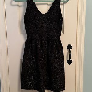 Love ady black mini dress with gold sparkle. Small